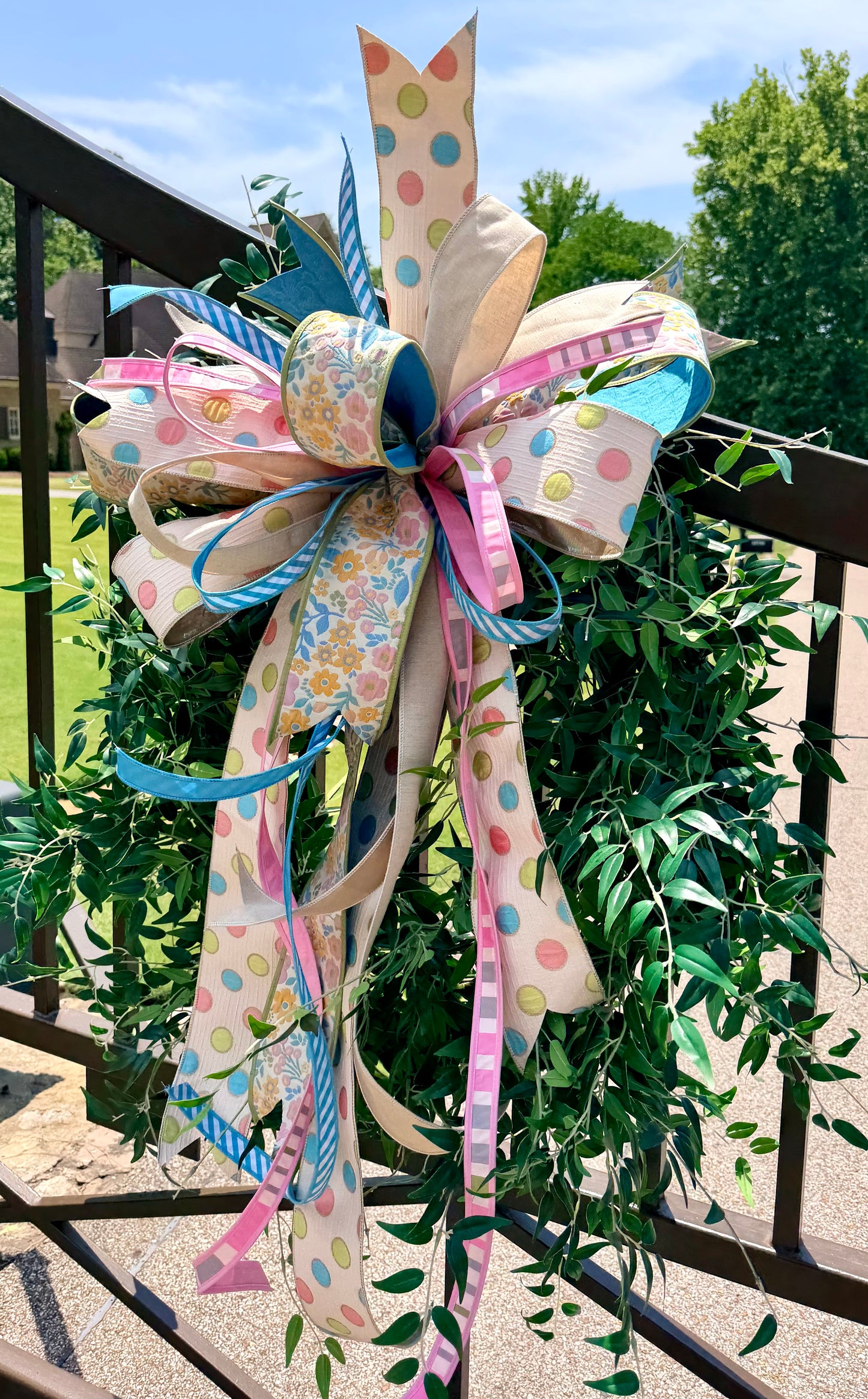 Handtied JME polka dot and floral Summertime bow. Some fluffing may be required upon receiving.