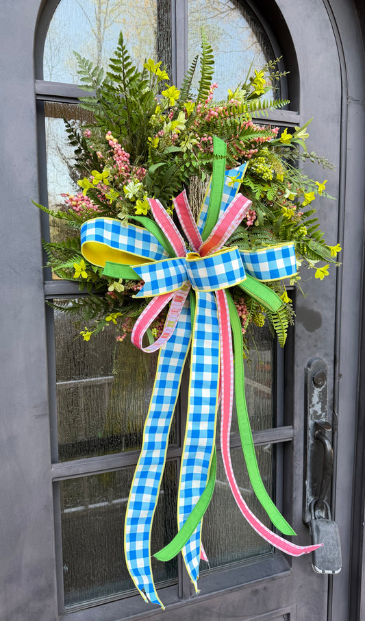 Handmade JME wreath. Made of pink berries, mixed foliage, and chartreuse wild flowers. Paired with a JME blue and white checked hand tied bow. About 24 inches in diameter.