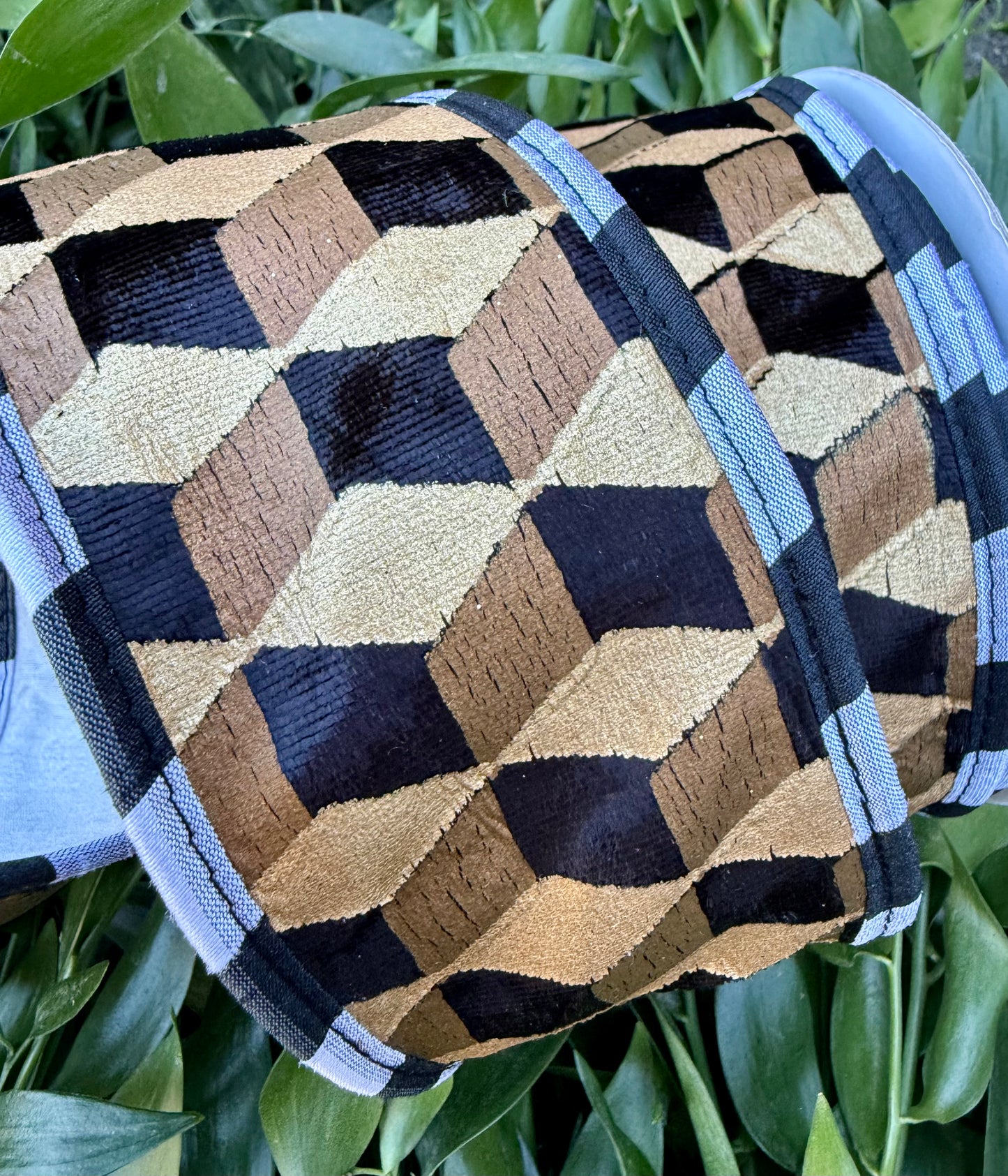 JME heavy wired ribbon. Velvet and metallic gold and black Geo print. With white backing. 2.5“ x 10 yards.