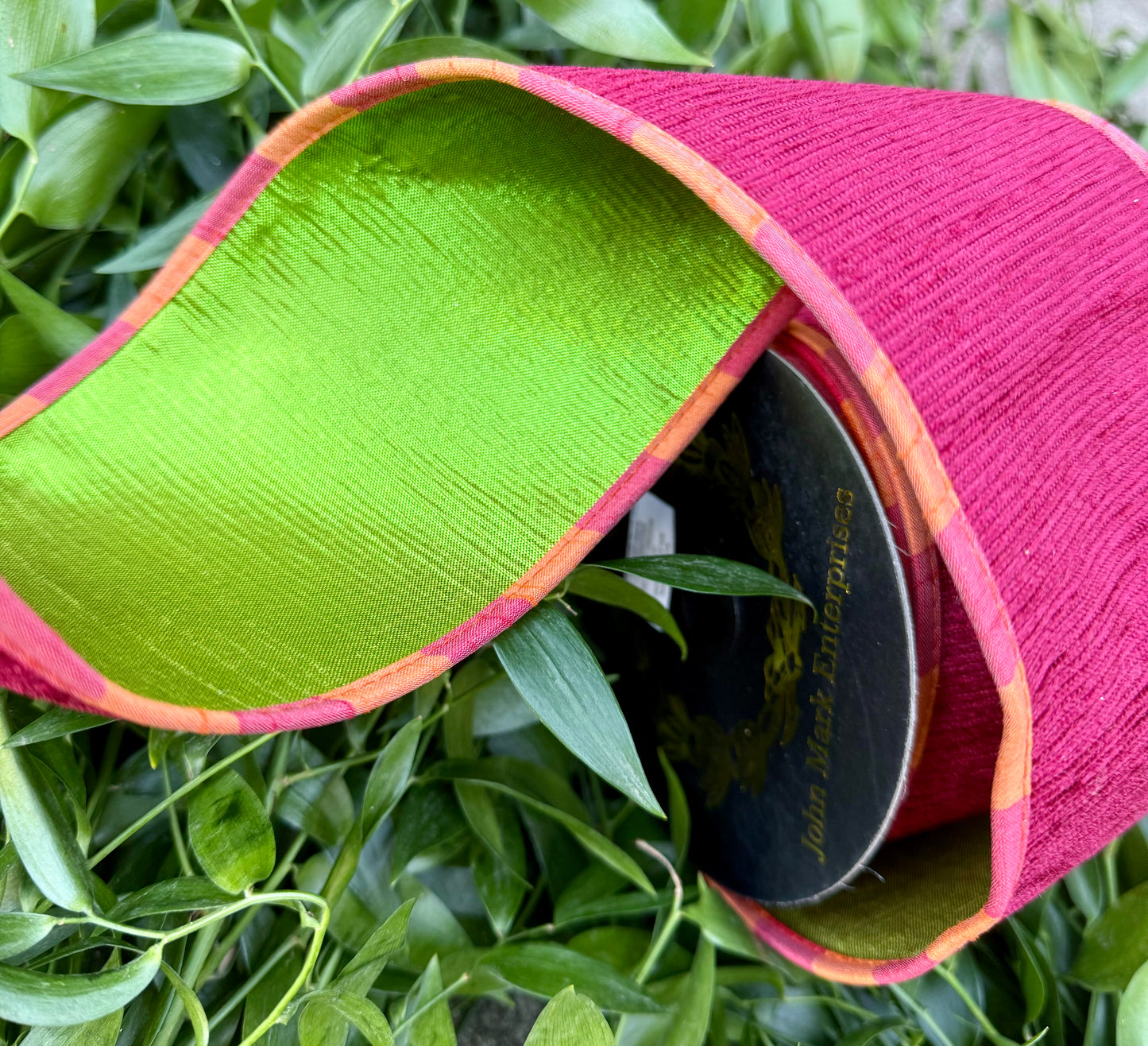 JME heavy wired ribbon. Red Apple Chenille with orange and coral piping with a green metallic back. 4“ x 10 yards.