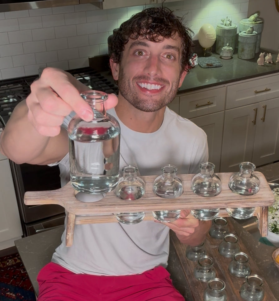 Easy arranger made of a cutting board to hold small bottles.