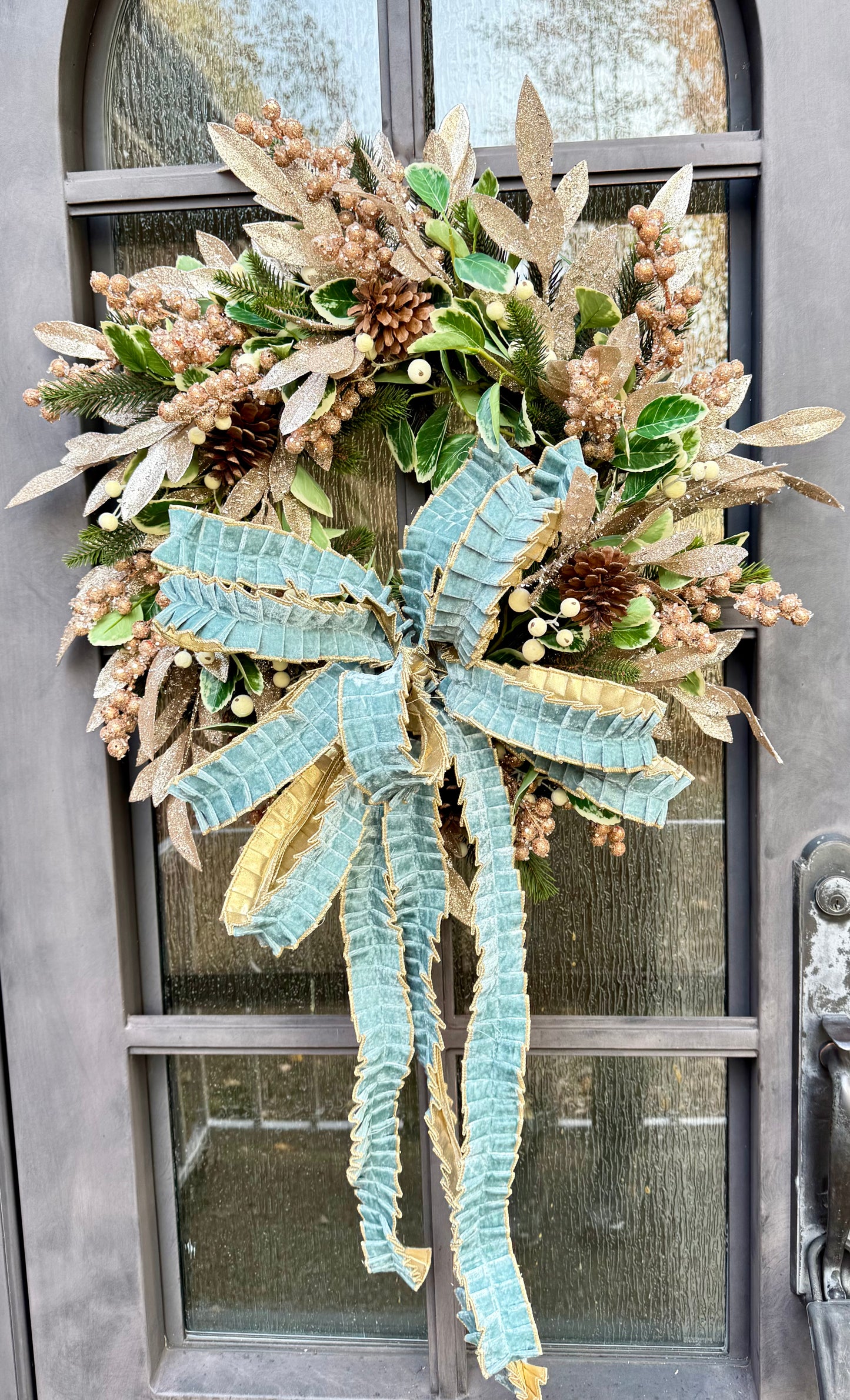 Winter blues wreath. Handmade by JME paired with a JME handtied ruffle bow. About 24inches wide.
