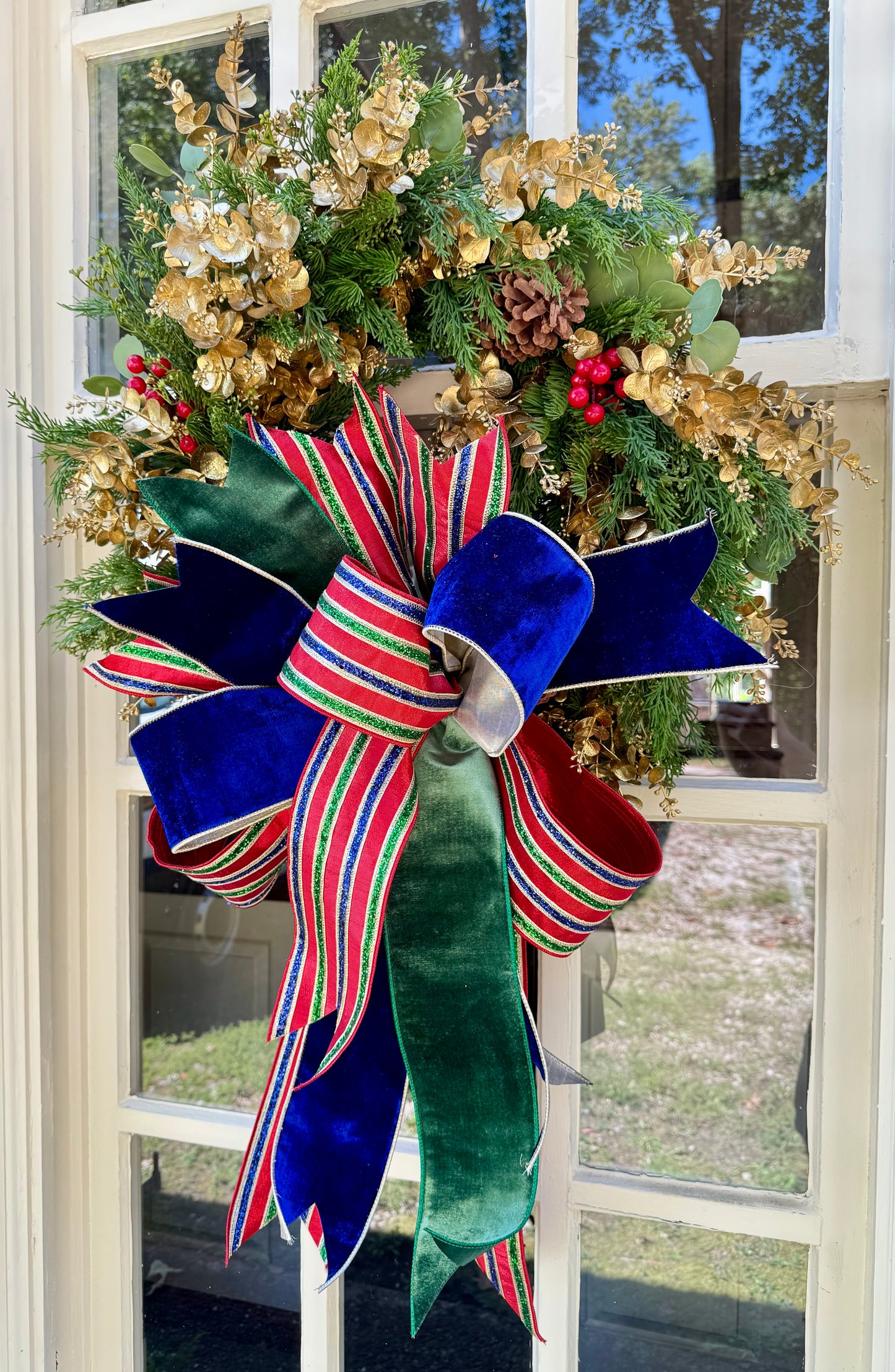 Nutcracker inspired wreath. Handmade faux wreath by JME paired with a hand-tied bow.