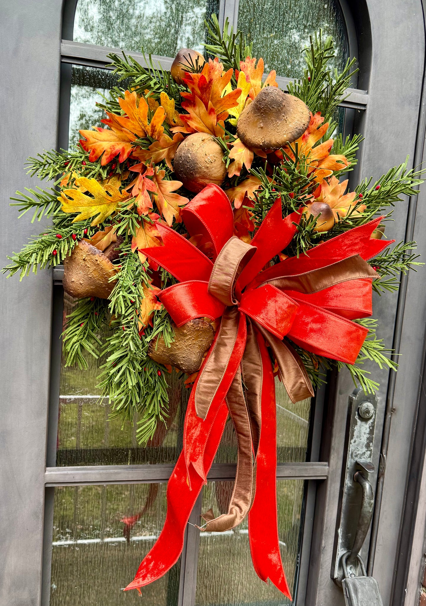 Mushrooms for fall! JME handmade wreath with a JME hand, tied orange velvet bow. About 24 inches wide.