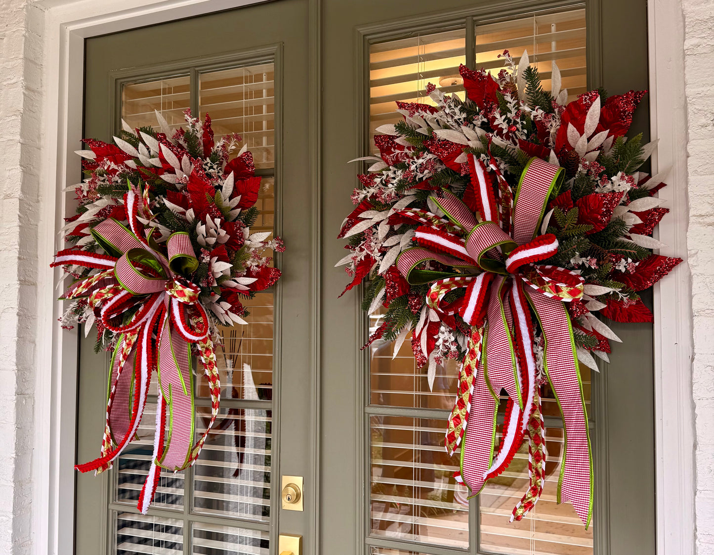 Candy Cane inspired wreath. Handmade by JME paired with a JM hand tied bow. About 24inches wide.