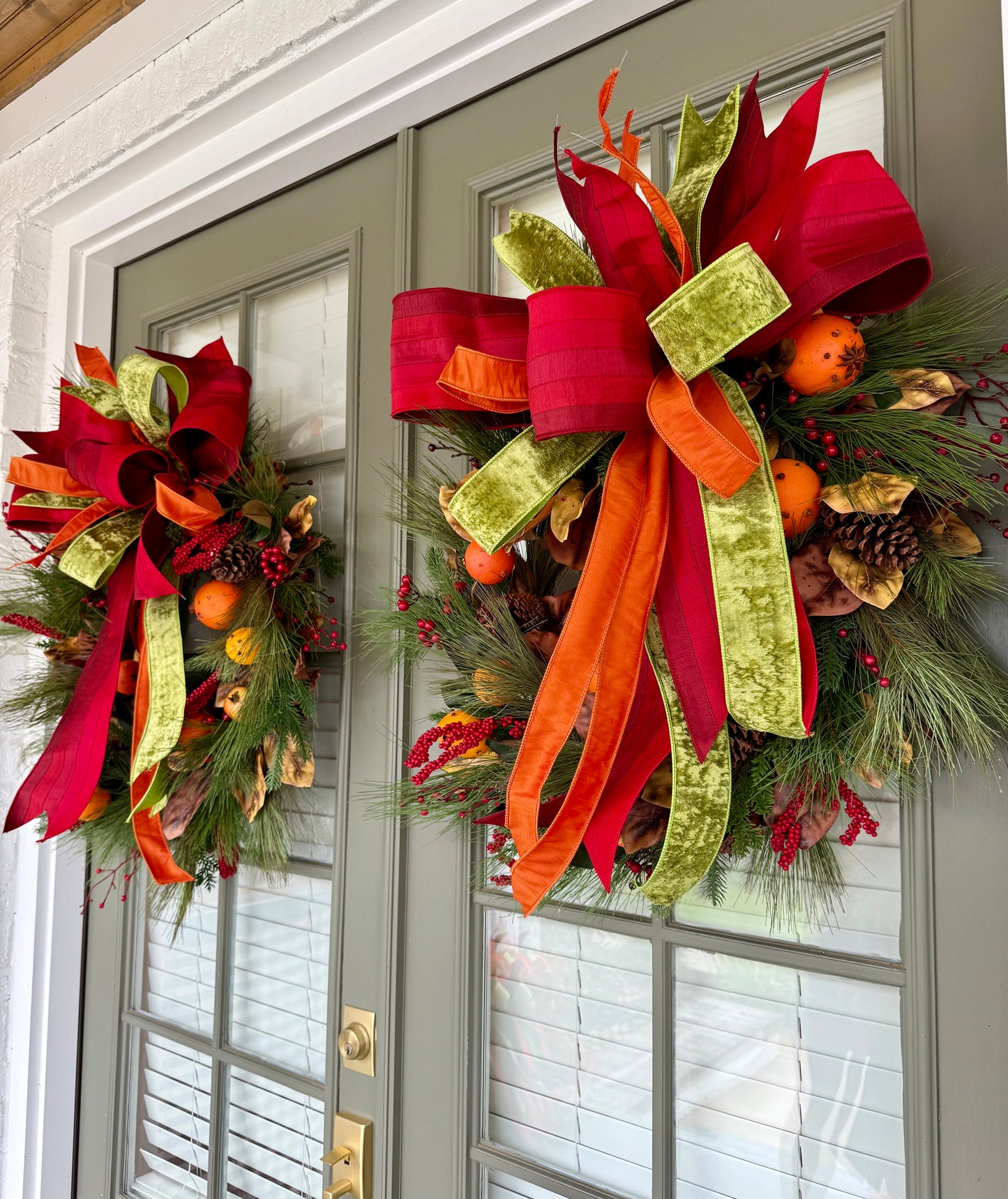Faux Cove and fruit wreath with hand tied JME bow. About 24 inches wide.