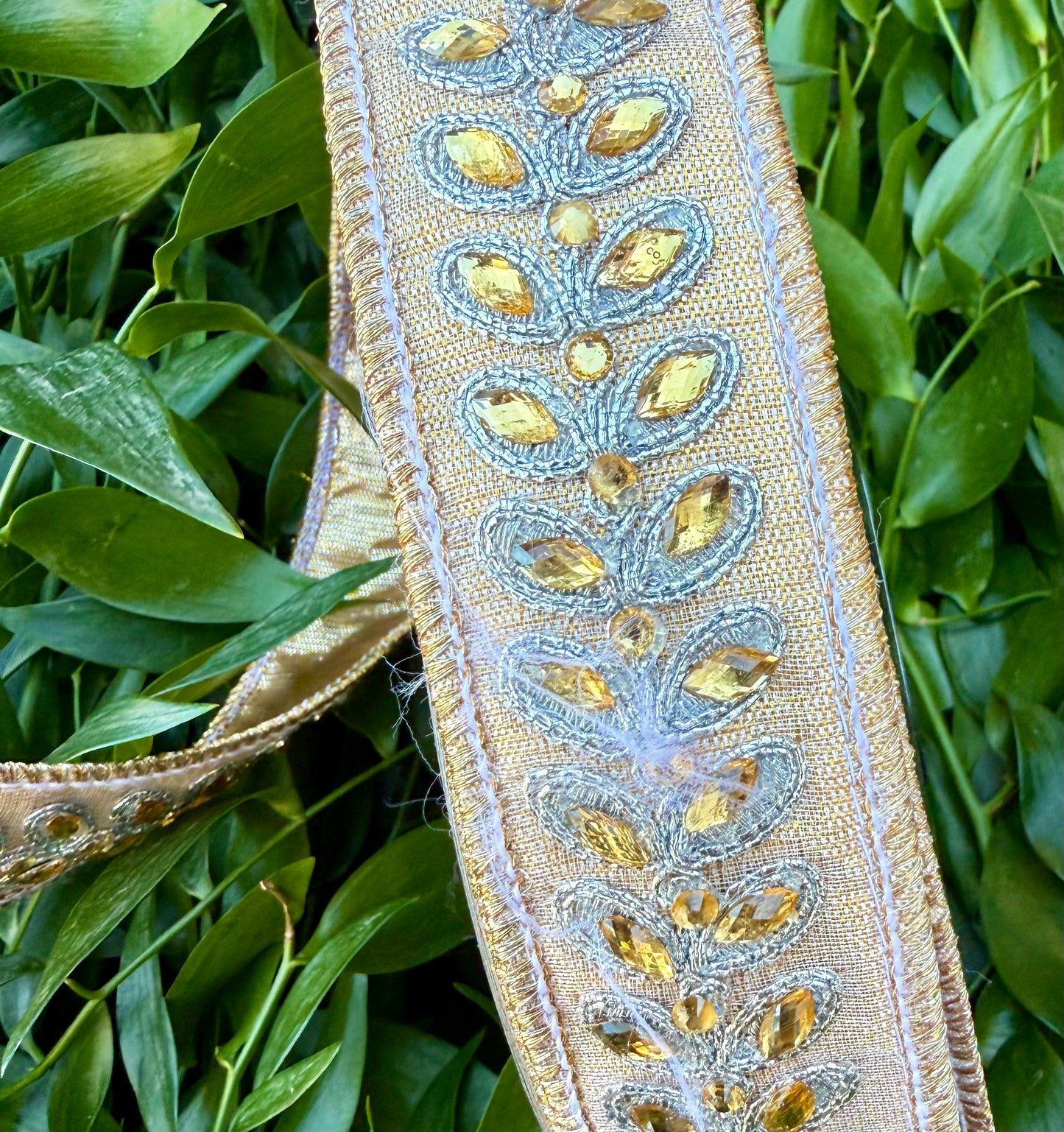 JME heavy wired ribbon. Metallic gold with Jeweled leaf band. 1.5“ x 10 yards.