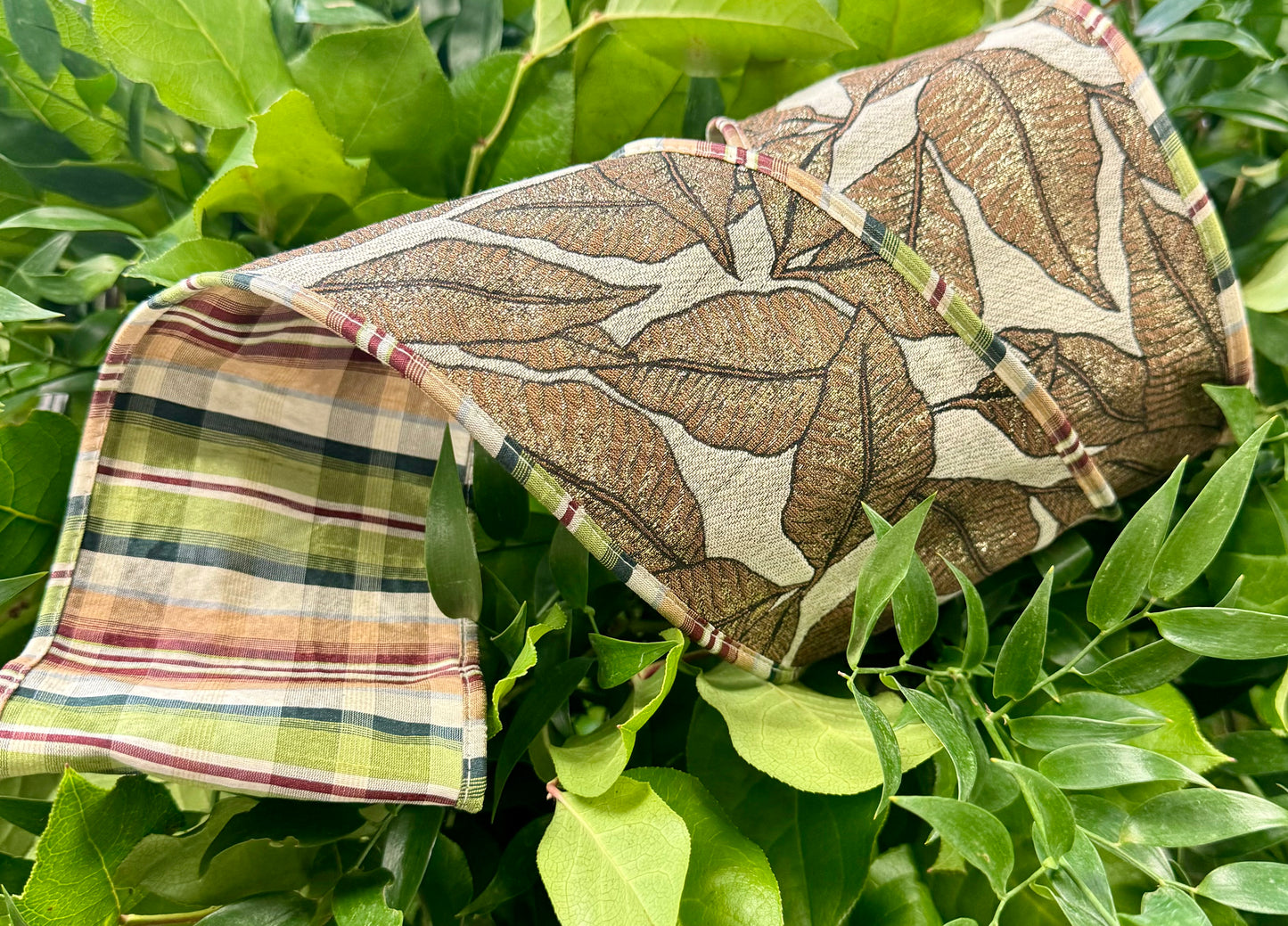 JME heavy wired ribbon. Leaf Pattern with dupion Plaid Back and piping. Heavy wired ribbon. 4 inches by 10 yards.