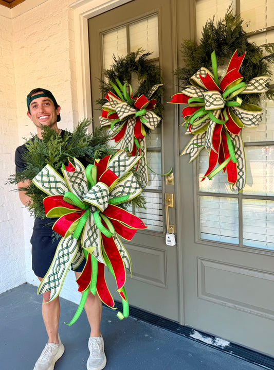 The Countryside Wreath. Handmade JME wreath with a hand tied bow. About 24 inches wide. *Some fluffing may be required upon receiving.