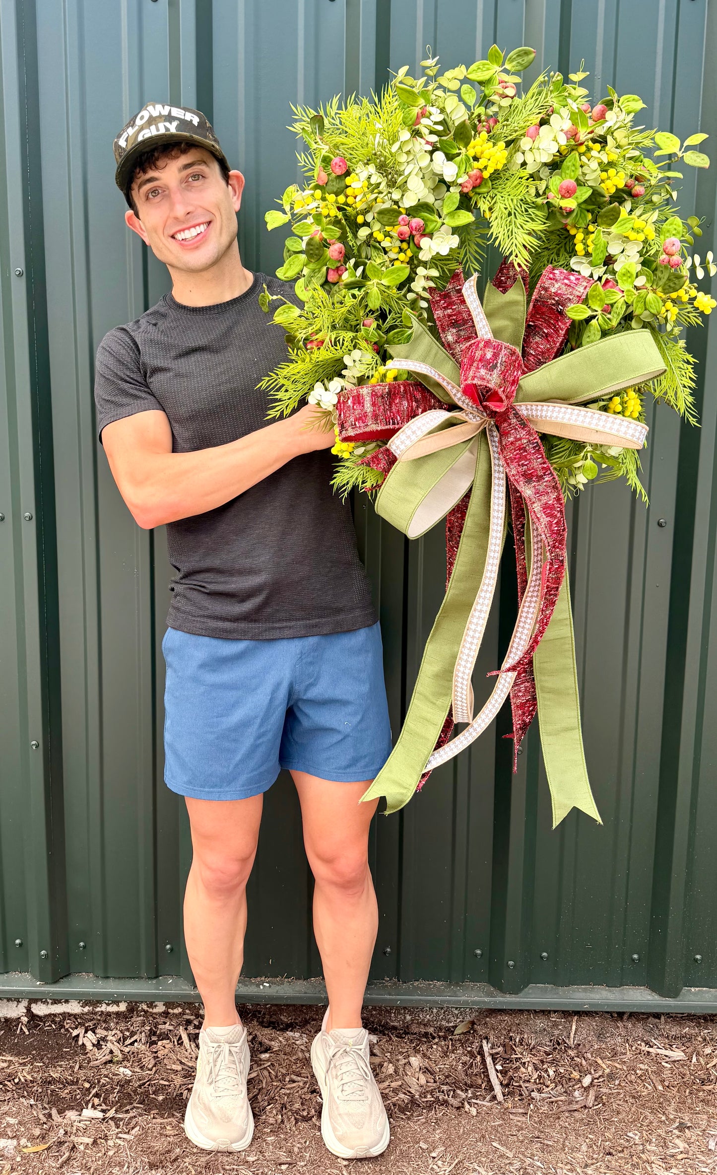 JME HANDMADE WREATH. Lush mimosa Apple wreath. Paired with a JME hand tied bow. About 26 inches wide.