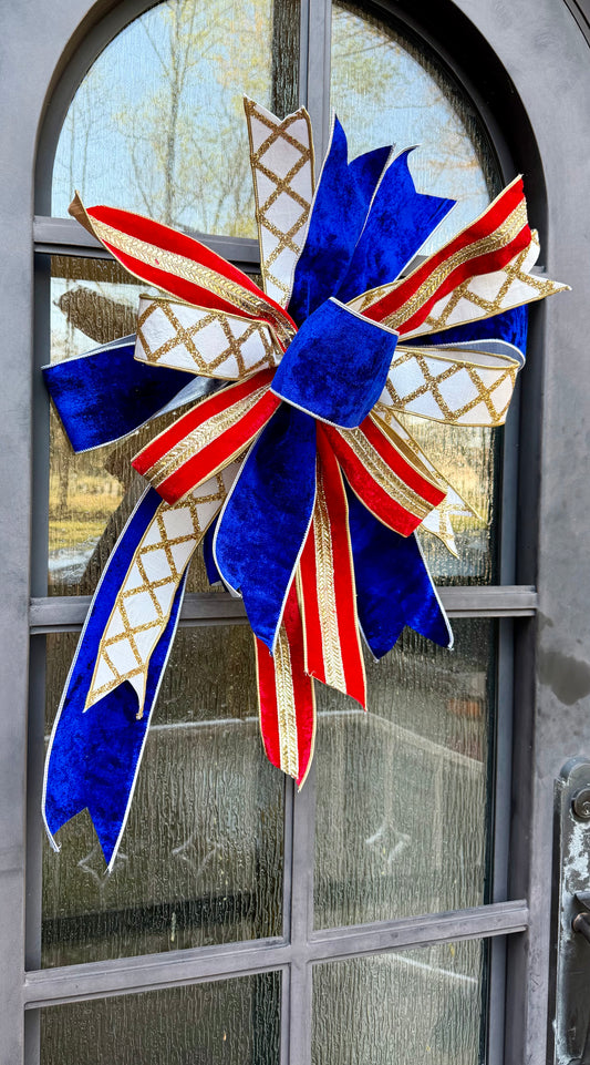 JME hand tied red white and blue bow. Made from rich velvets either jewels and sparkles.