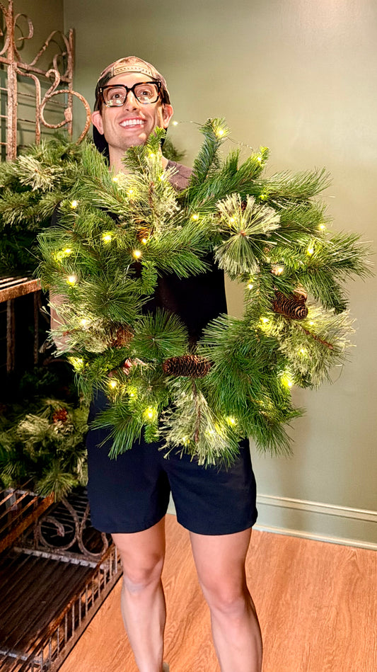 LED Lit 24" Wreath. Battery operated. Requires 3 AA batteries.