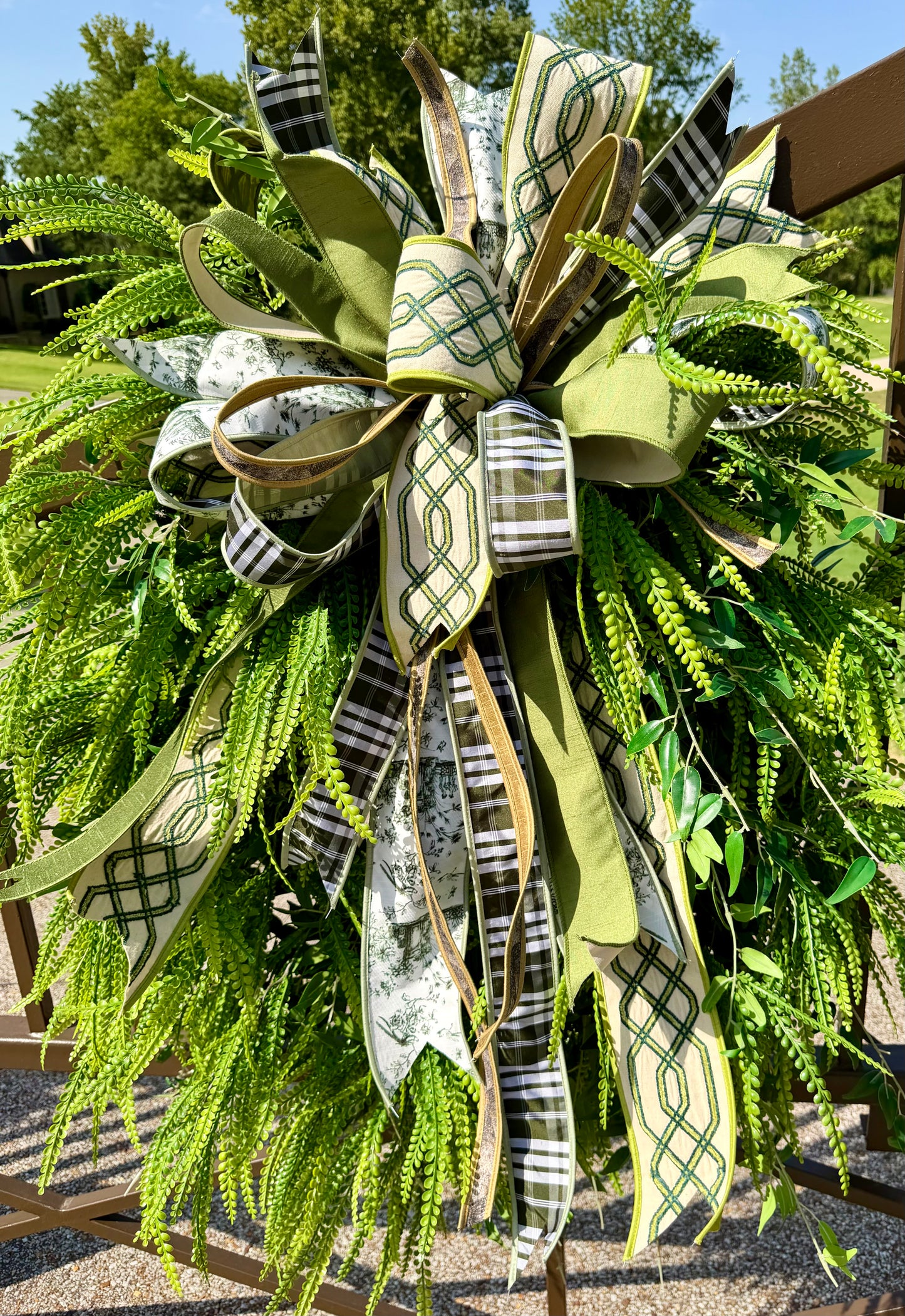 Green/neutral themed bow. Hand tied JME bow. Bow ONLY greenery not included   *some fluffing may be required upon receiving.