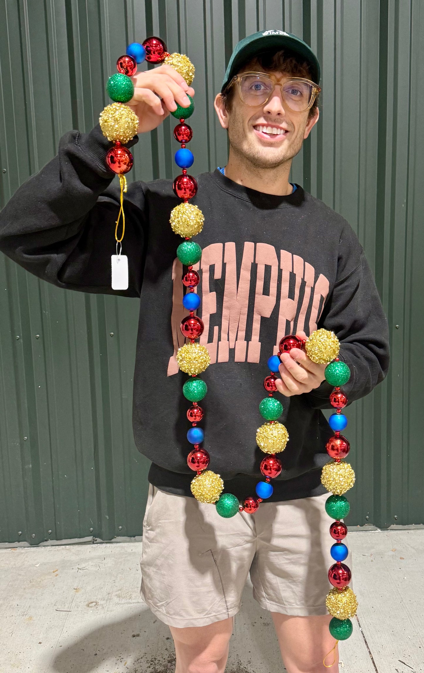 Gold, red emerald and royal ball garland. A collection of sequin and glittered Balls strong together. 72 inches long. Shatter proof