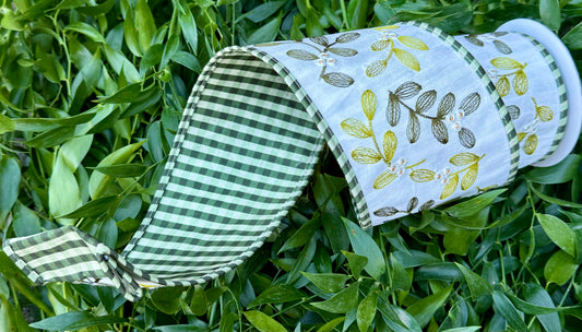 JME heavy wired ribbon. Embroidered foliage back with green, checked and piped in checked. White/green. 4” x 5 yards.