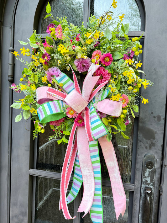 JME hand made wreath. Pink and Yellow Florals with Crabapples and Mixed Greenery with Light Pink JME hand tied bow. About 20 inches in diameter.