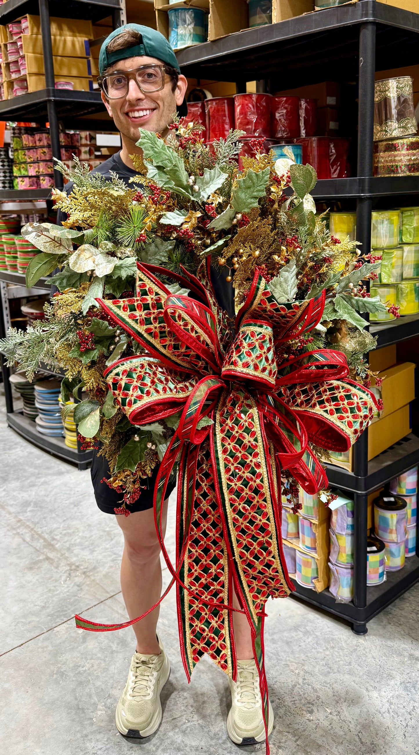 Glitz and bling handmade wreath by JME WITH JINGLE BELLS paired with a hand tied bow by JM. about 24inches wide.