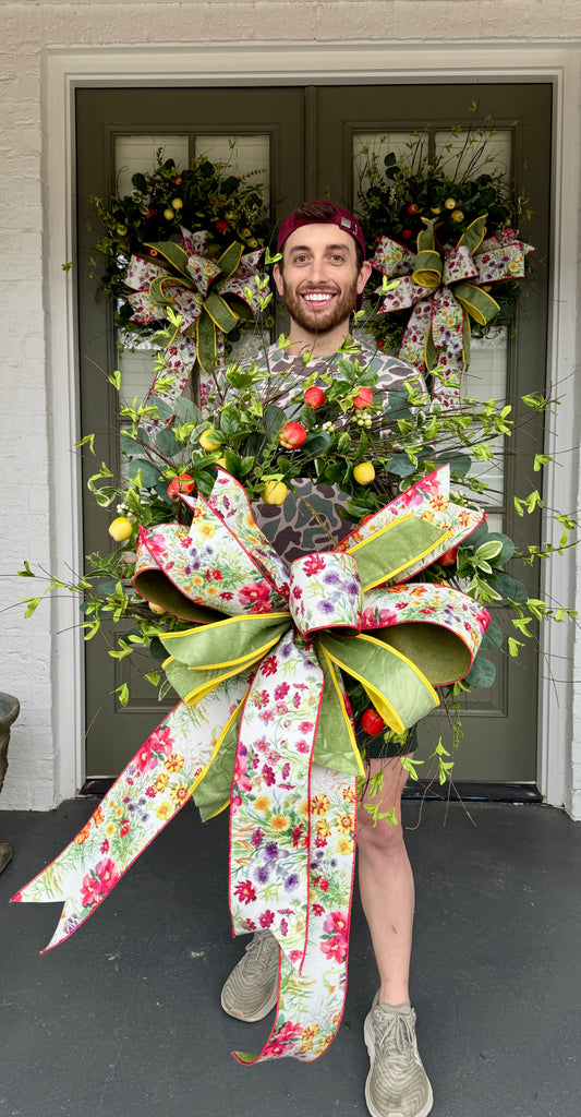 Hand made apple wreath by JME with a hand tied wild flower bow. 22inches wide