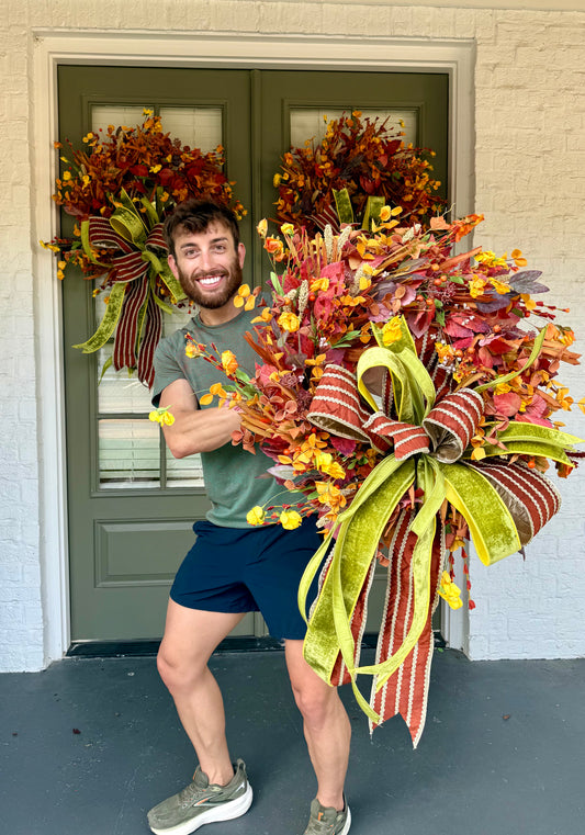 Faux harvest wreath made and designed by JME with a hand-tied JME bow. About 26 inches wide.