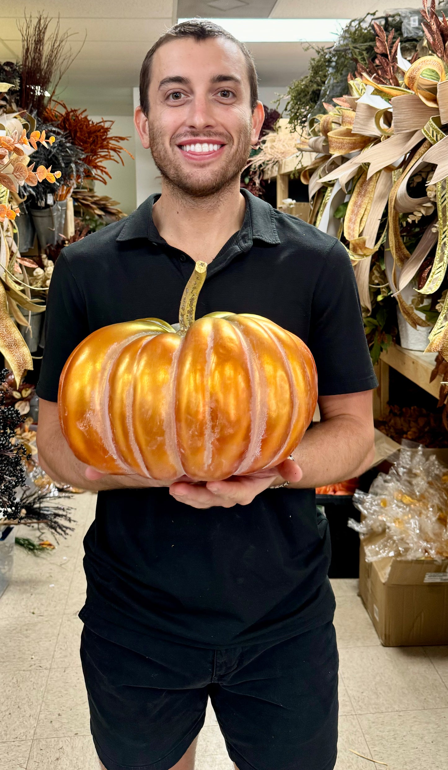 Orange and green pumpkin with gold stem. 12 inches