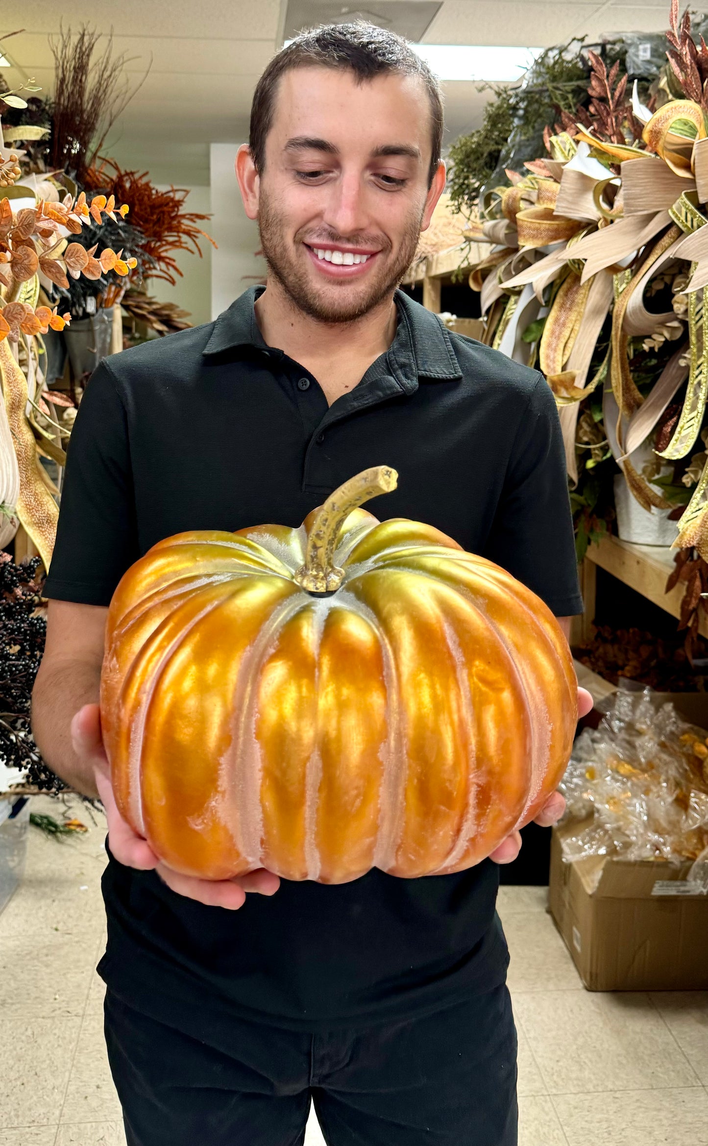 Orange and green pumpkin with gold stem. 12 inches