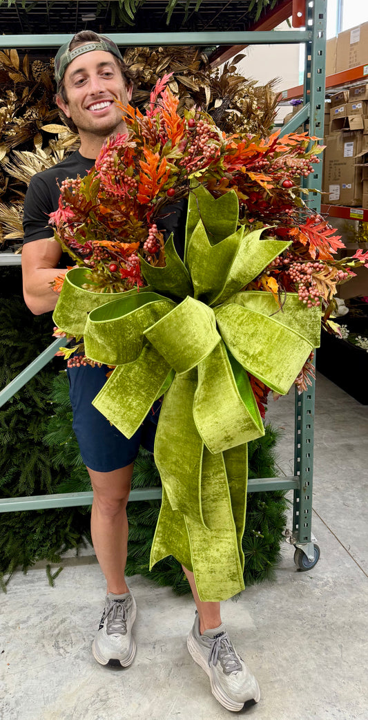 Faux mixed fall leaf wreath with JME chartreuse green velvet bow   About 24 inches wide.