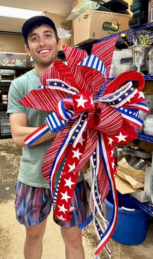 Patriotic premade bow by John Mark. Some fluffing of the bow may be required.