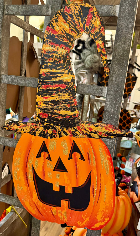 Metal jack-o’-lantern with witch hat stake. Orange. 24 inches. Has an easel that can be propped up on the back and it has a hook that could be hung on the door or wall.