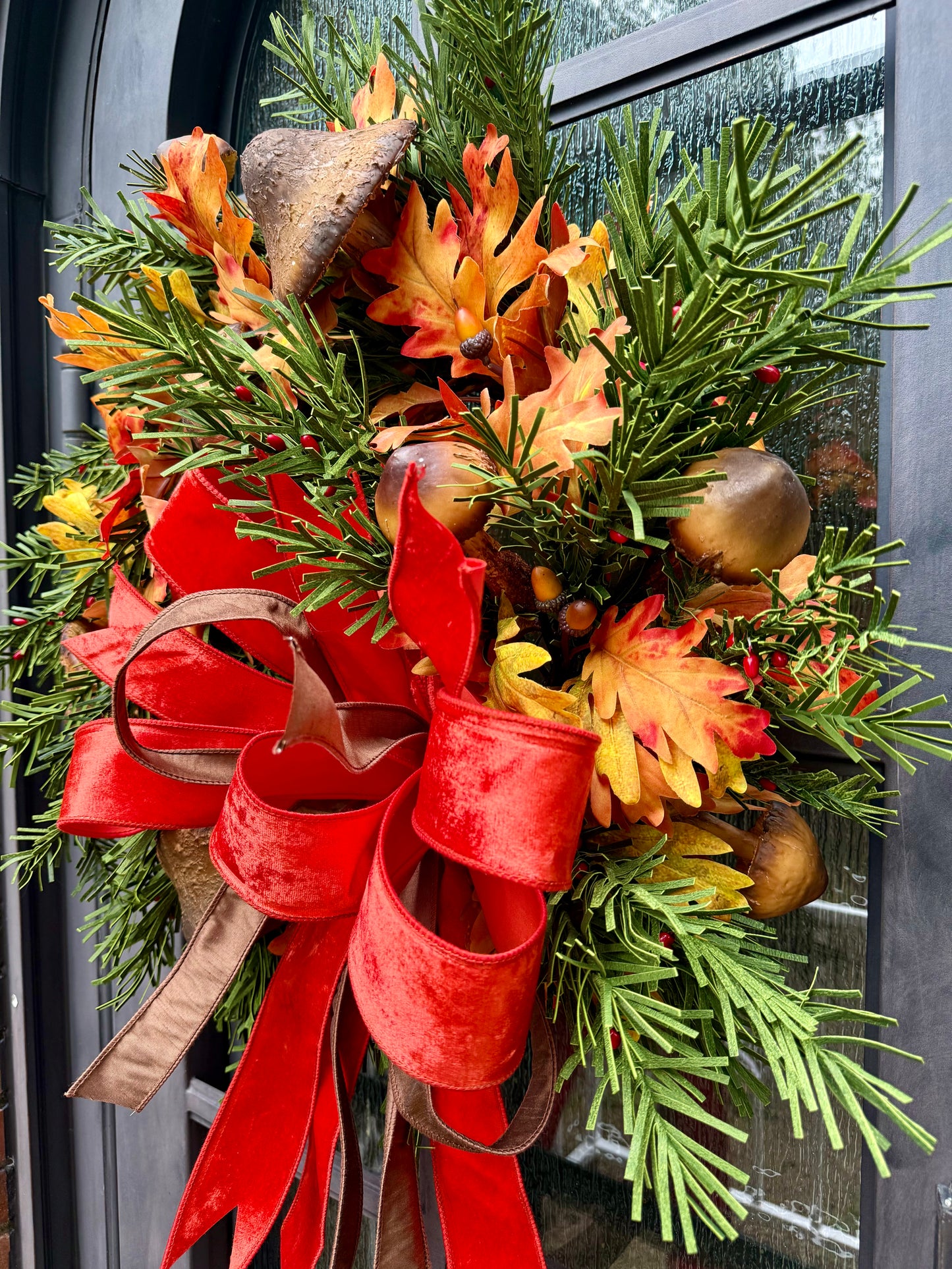 Mushrooms for fall! JME handmade wreath with a JME hand, tied orange velvet bow. About 24 inches wide.