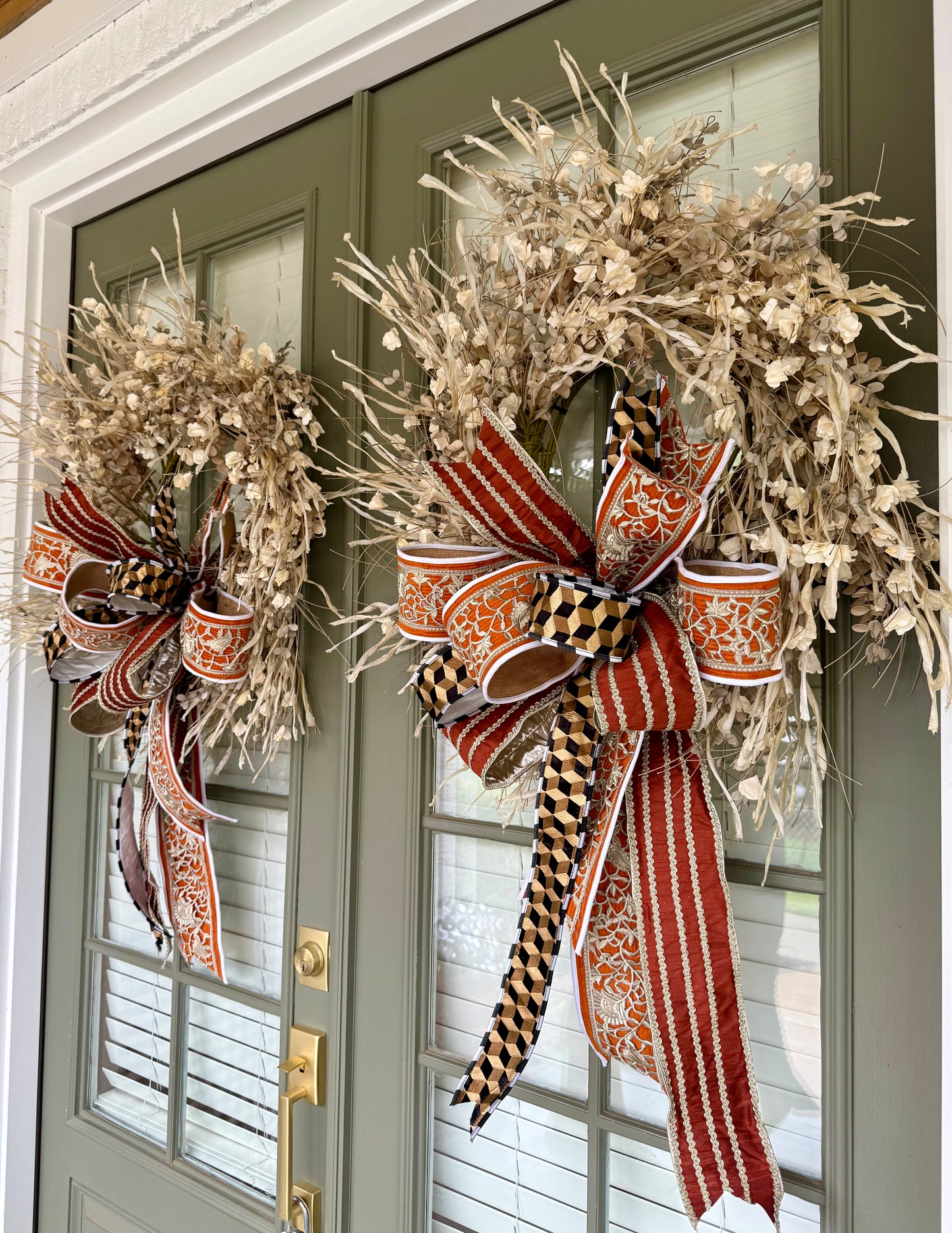 Faux cream paper flower wreath with JME hand tied bow. About 24 inches.