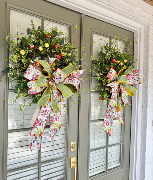 Hand made apple wreath by JME with a hand tied wild flower bow. 22inches wide