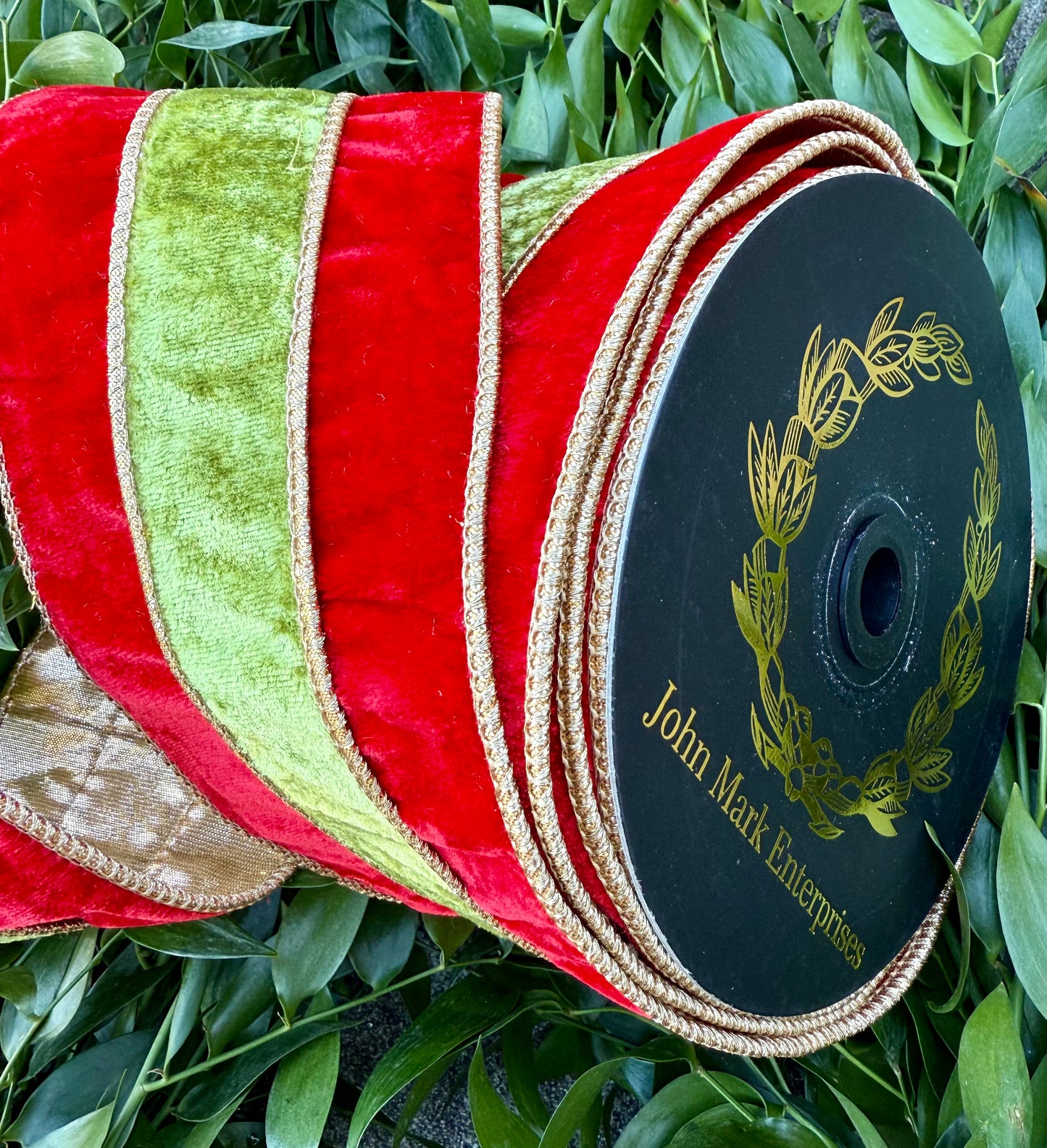 JME heavy wired ribbon. Red/green velvet striped with metallic gold back. 4” x 10 yards.