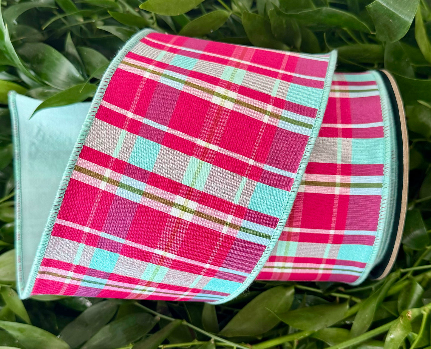 Rose plaid wired ribbon with light dusty blue backing. 4” x 10 yards.