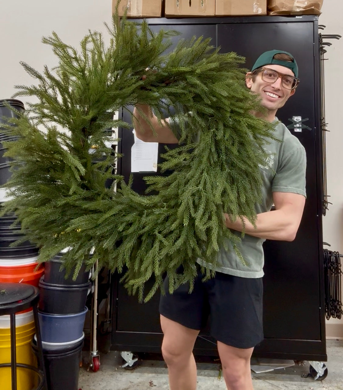 42 inch faux Northfolk Pine wreath. Very realistic feeling. Great for indoor or outdoor. ￼