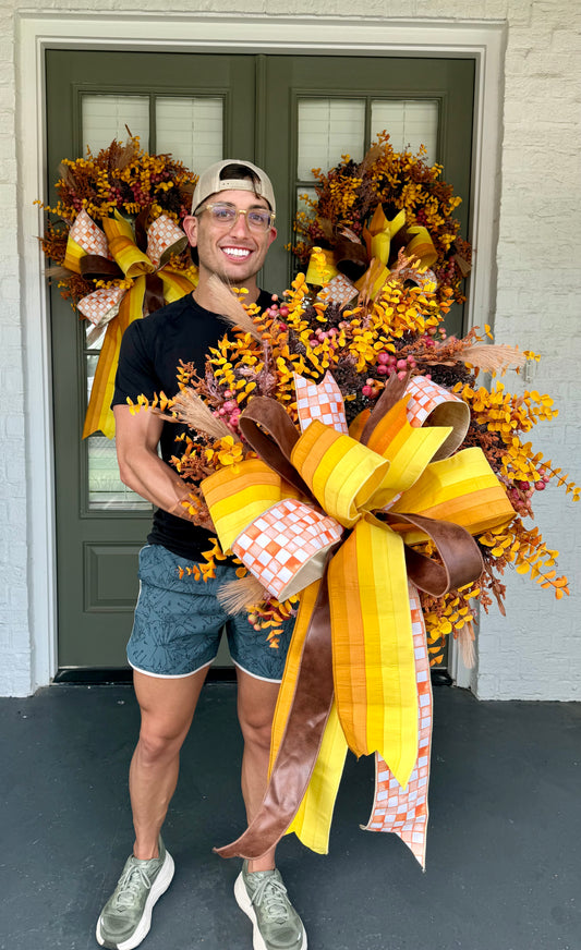 Orange checked ribbon, Faux Mixed fall foliage wreath with hang tied JME bow. About 24 inches wide.