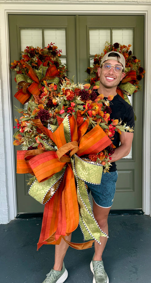 Faux fall wreath with dahlias and a hand tied JME bow.