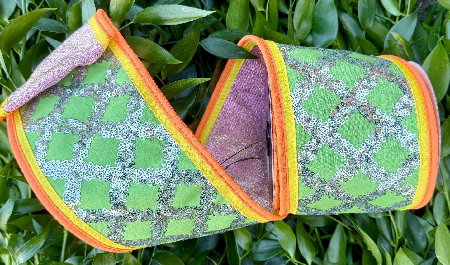 JME heavy wire ribbon. Green dupion ribbon with silver diamond sequin pattern with neon yellow/orange piping back with pink metallic. 4“ x 5 yards.