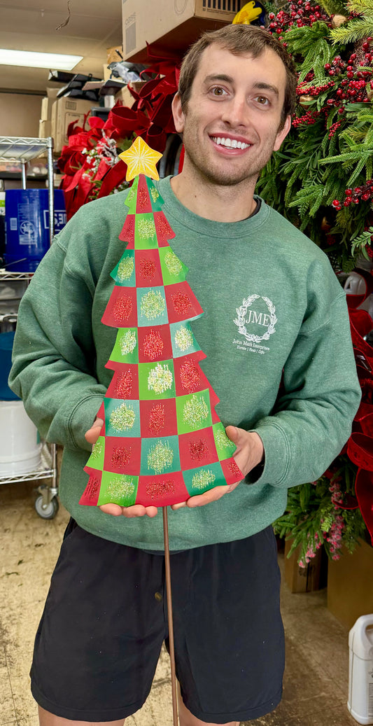 Metal tree with red and green CHECKED. Made for indoor outdoor use can be hung on the door or staked in the yard or planter. Stake comes off.