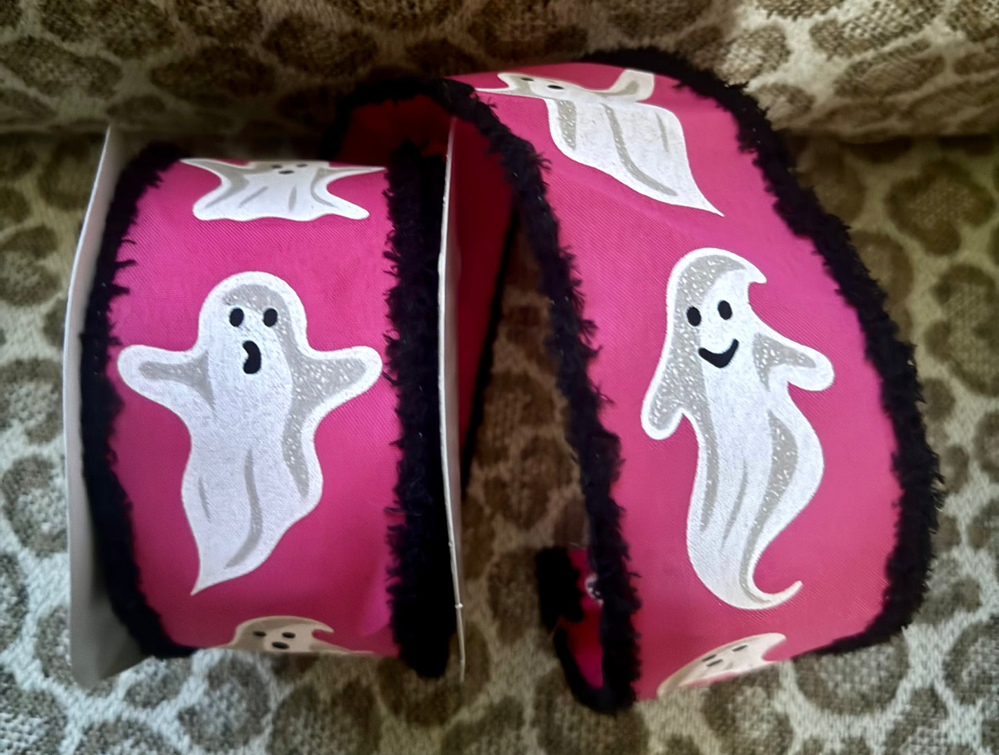 Hot pink polyester wired Ribbon with White ghosts and Black Fringe trim
2.5"x10yards.