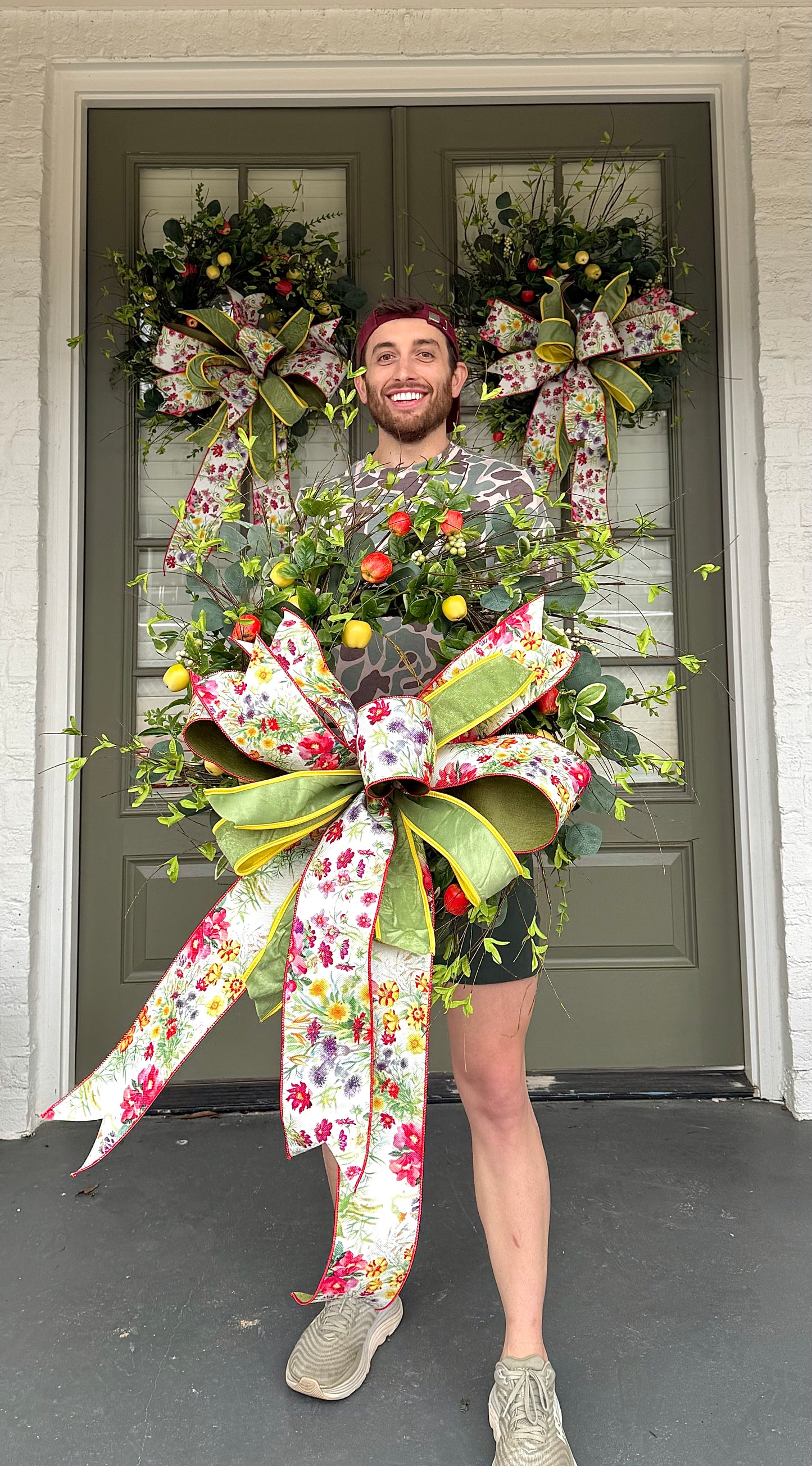 Hand made apple wreath by JME with a hand tied wild flower bow. 22inches wide