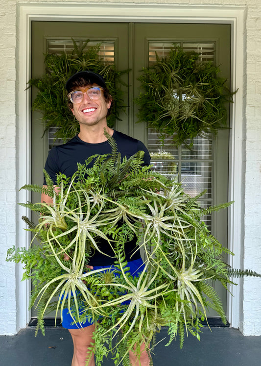 JME faux Succulent and fern wreath. Around 24 inches wide.