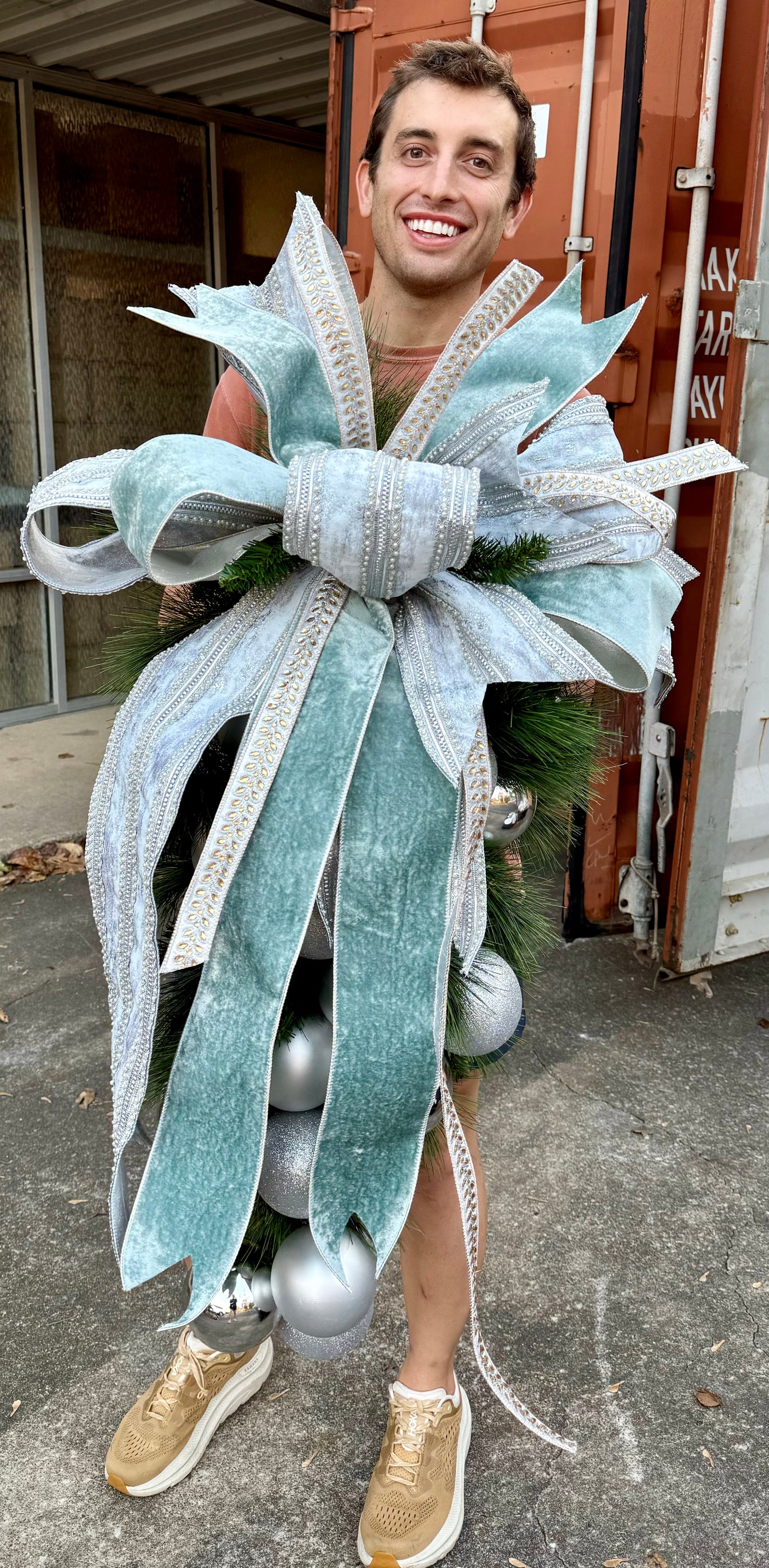 Traditional SILVER ball cluster door swag with a hand tied JME bow. Approximately 24 inches wide by 45 inches long.