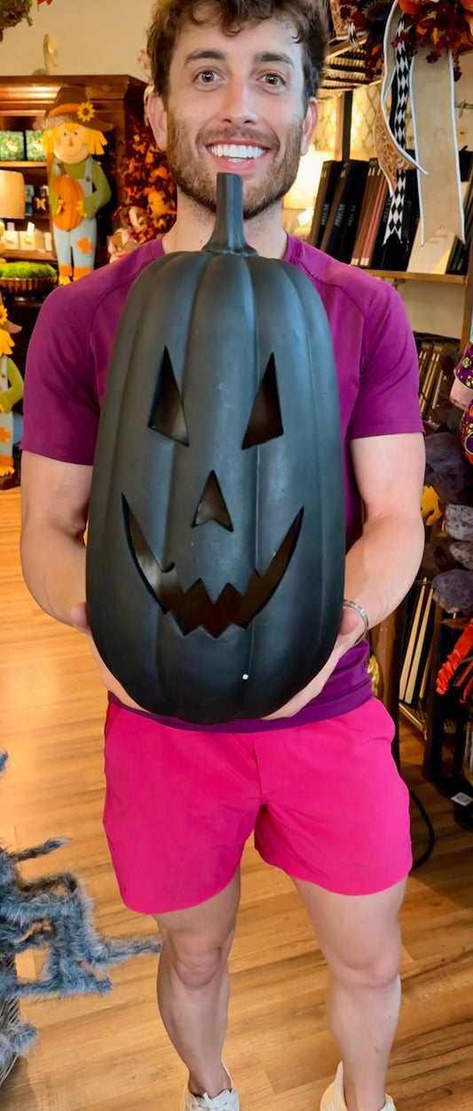 Large Black jack-o’-lantern. With LED light. Runs on batteries. 17 inches.