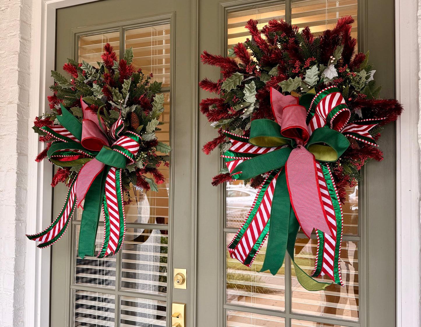 Red tinsel wreath with JME hand-tied bow. About 24 inches wide.