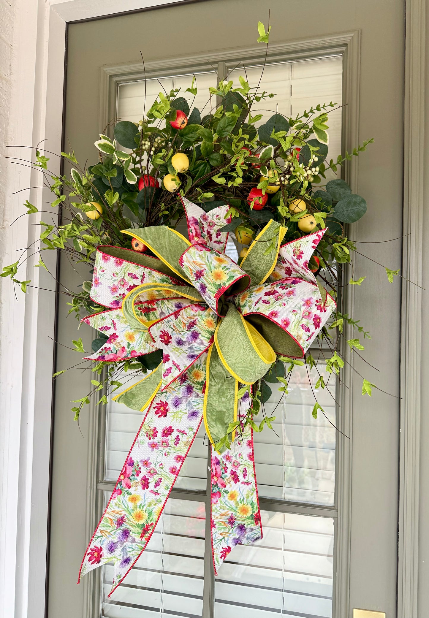 Hand made apple wreath by JME with a hand tied wild flower bow. 22inches wide