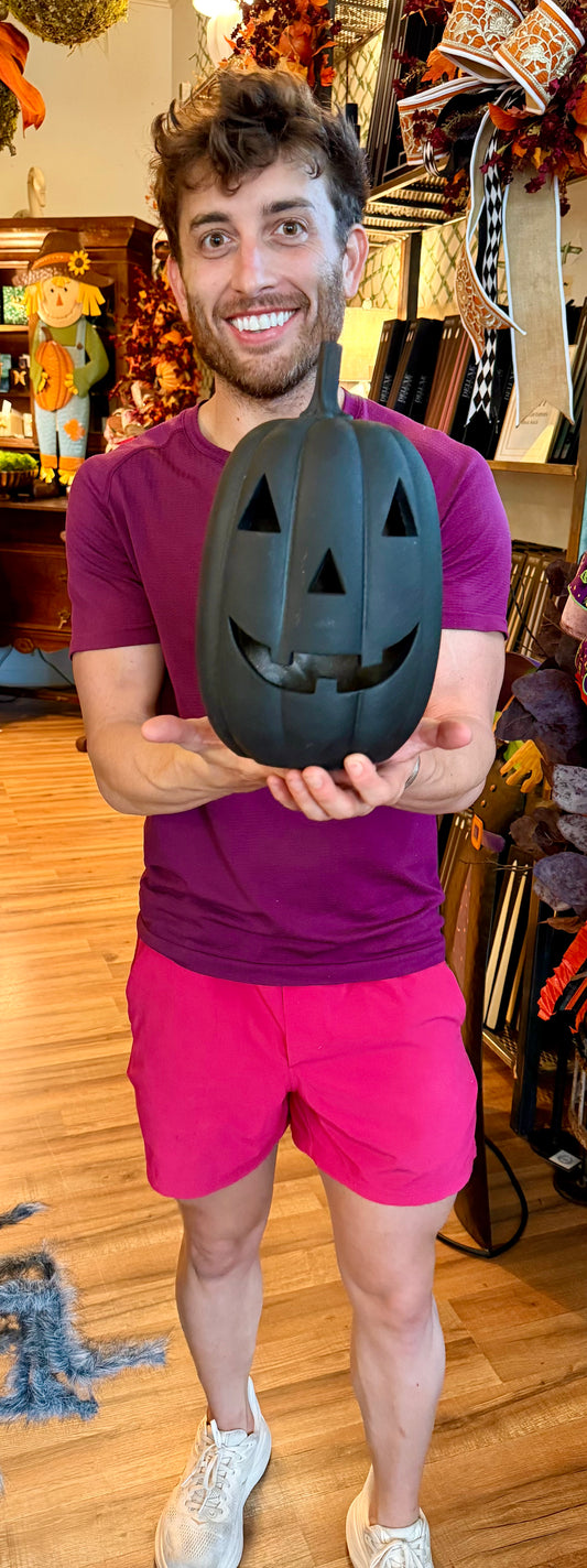 Small Black jack-o’-lantern. With LED light. Runs on batteries. 11 inches.