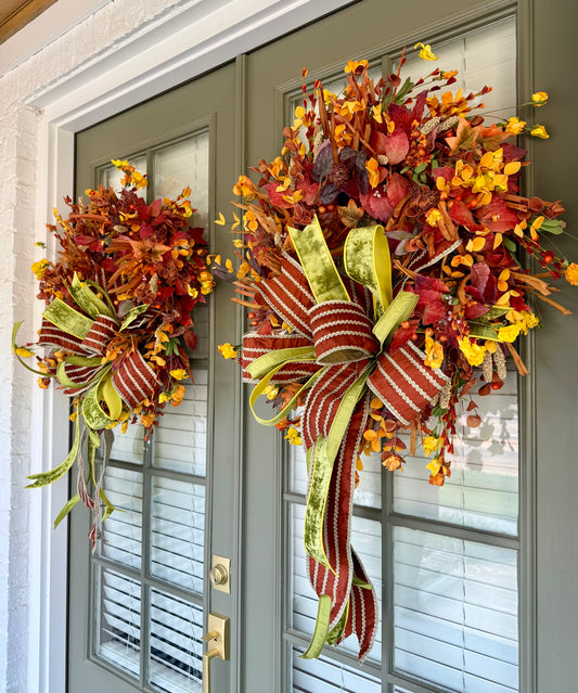 Faux harvest wreath made and designed by JME with a hand-tied JME bow. About 26 inches wide.