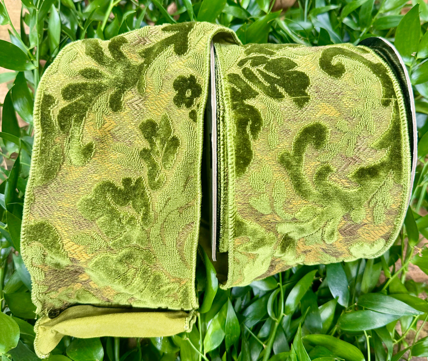 Raised floral velvet on green wired ribbon with a sheer wired back. 10 yards x 4”