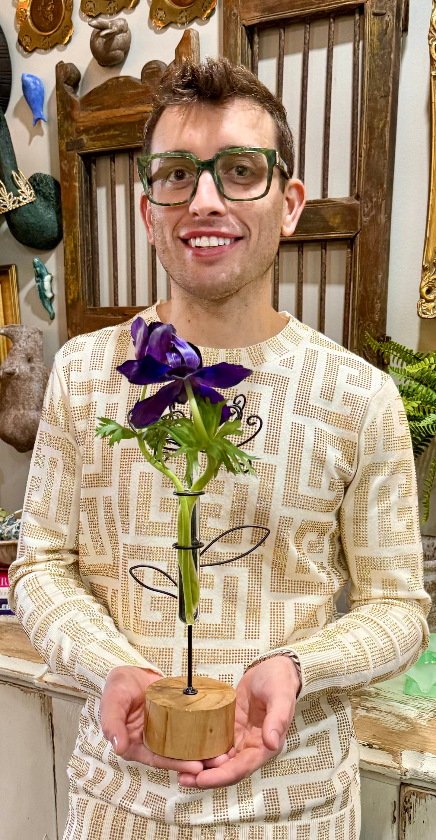 Metal flower bud vase on wood base.