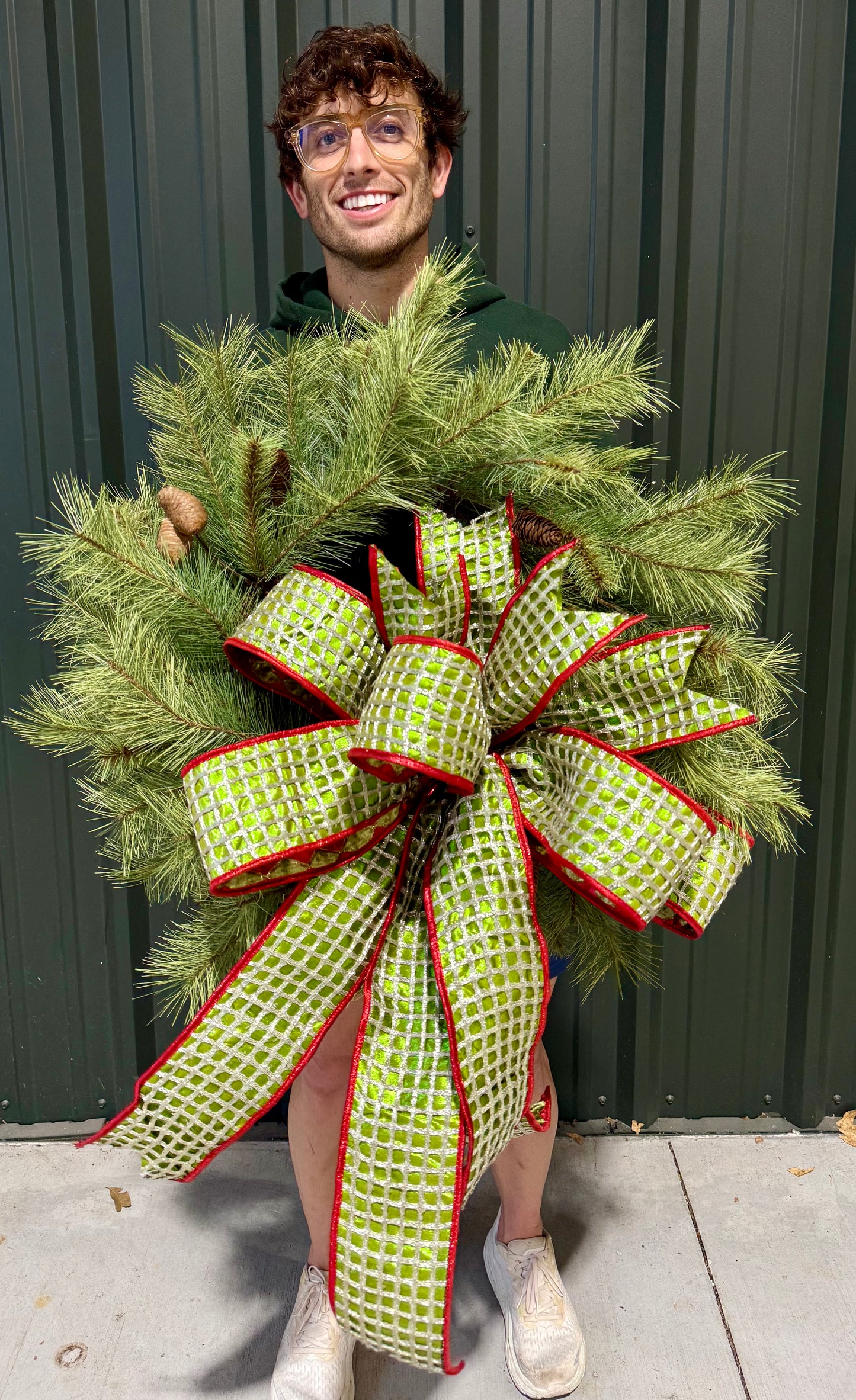 24 inch lush PINE wreath paired with a JME handtied bow.